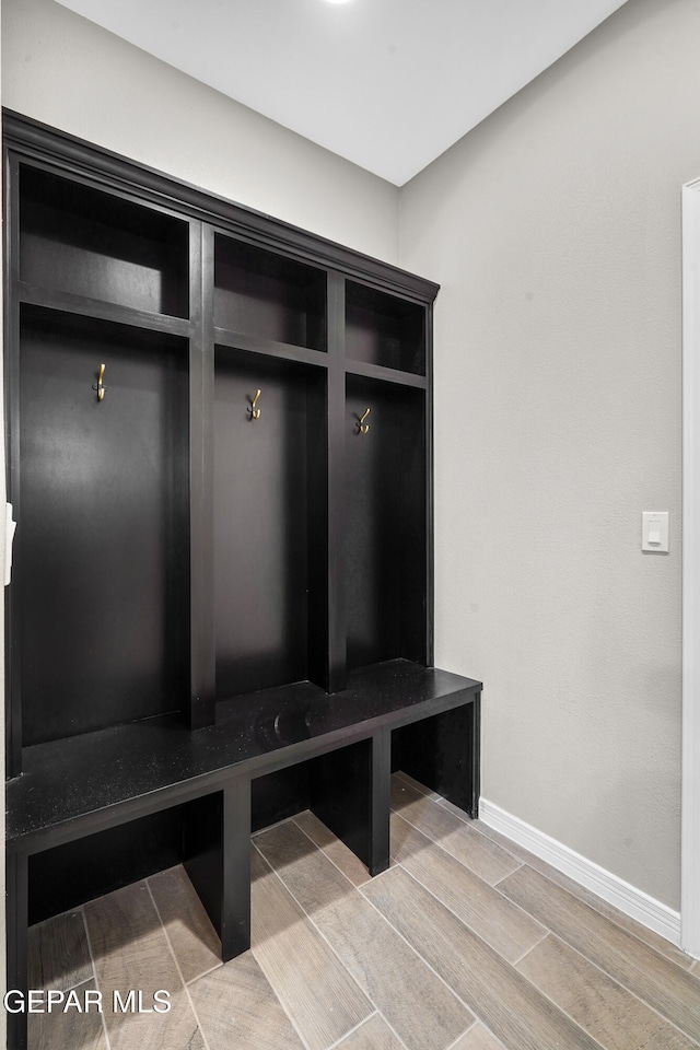 mudroom with hardwood / wood-style flooring