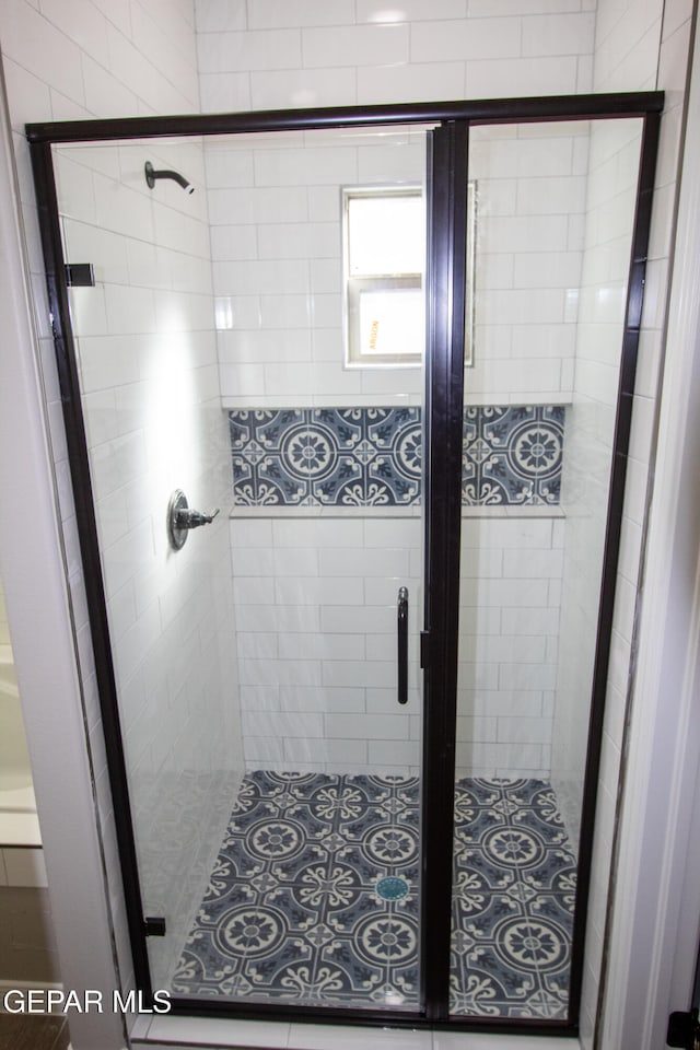 bathroom featuring walk in shower