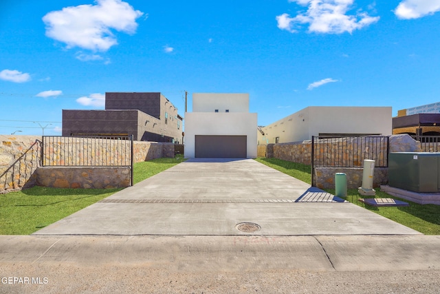 view of front facade featuring a garage and a front lawn