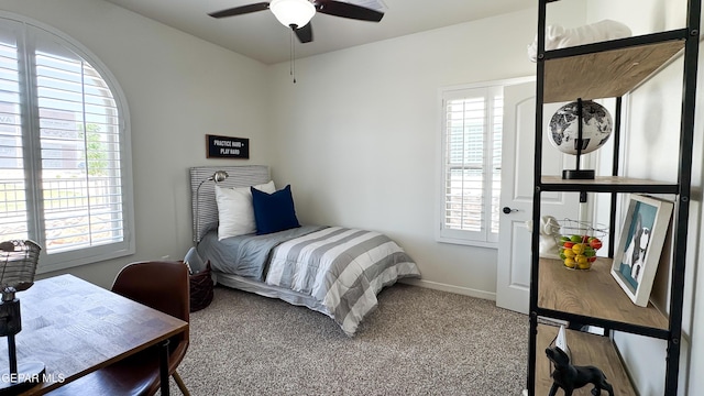 5844 Kobe Bryant St, El Paso, TX 79924 - bedroom with multiple windows, carpet, baseboards, and a ceiling fan