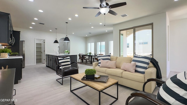 5844 Kobe Bryant St, El Paso, TX 79924 - living room with recessed lighting, light wood-type flooring, a ceiling fan, and baseboards