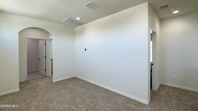 5844 Kobe Bryant St, El Paso, TX 79924 - unfurnished room featuring carpet, baseboards, arched walkways, and recessed lighting