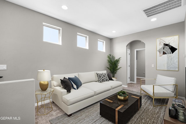 5844 Kobe Bryant St, El Paso, TX 79924 - carpeted living room featuring arched walkways, baseboards, and recessed lighting