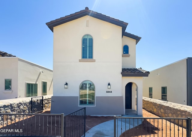 5844 Kobe Bryant St, El Paso, TX 79924 - mediterranean / spanish home featuring stucco siding, a fenced front yard, a tiled roof, and a gate