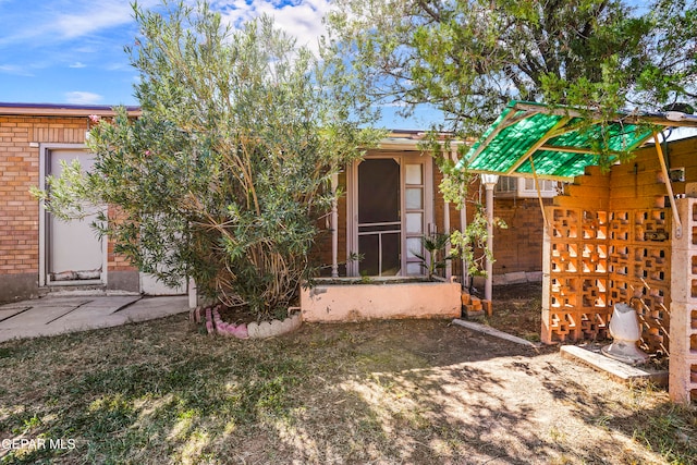 back of property featuring a sunroom