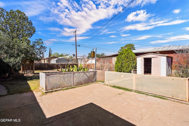 view of patio / terrace with a storage shed