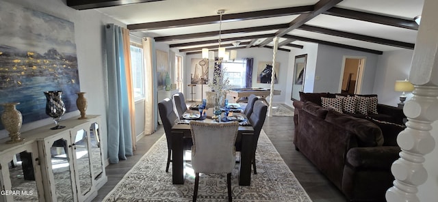 dining area with a notable chandelier, lofted ceiling with beams, and wood finished floors