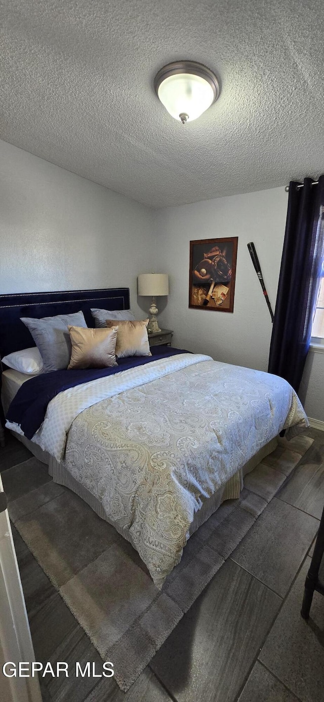 bedroom featuring a textured ceiling