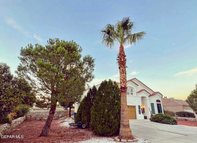 view of property exterior at dusk