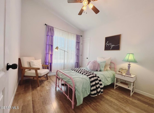 bedroom with vaulted ceiling, wood-type flooring, and ceiling fan