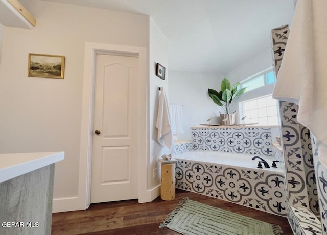 interior space featuring tiled bath and hardwood / wood-style flooring