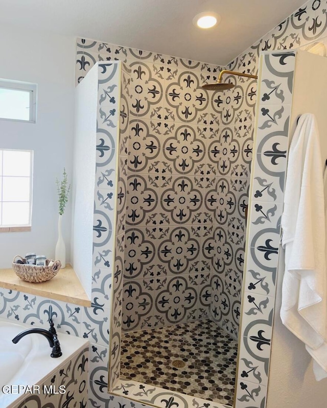 bathroom with tiled shower