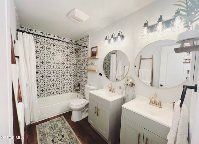 full bathroom featuring vanity, shower / bath combo, hardwood / wood-style flooring, and toilet