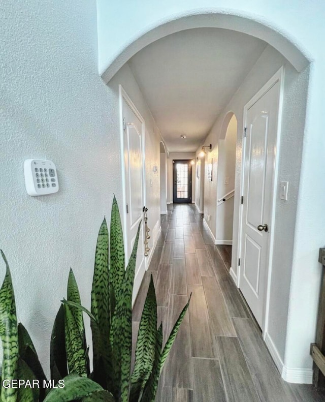 corridor featuring hardwood / wood-style floors