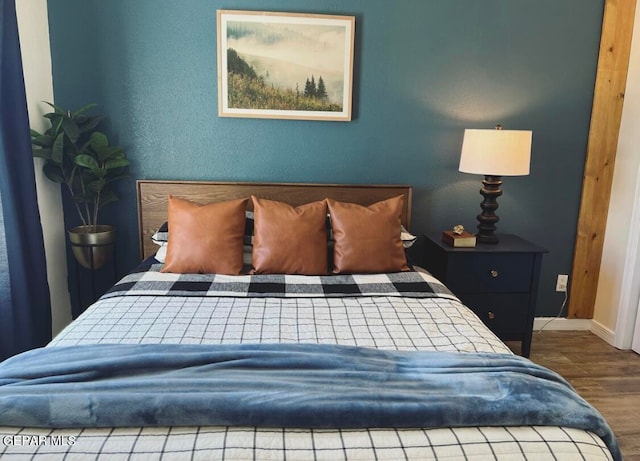 bedroom with hardwood / wood-style flooring