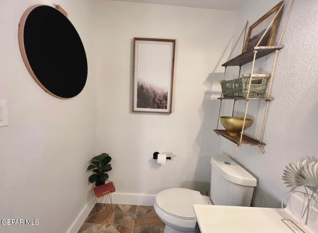 bathroom featuring toilet