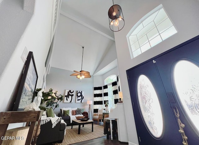 foyer featuring dark hardwood / wood-style floors, high vaulted ceiling, plenty of natural light, and ceiling fan