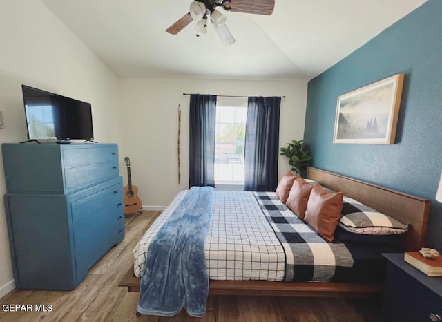 bedroom featuring ceiling fan and hardwood / wood-style flooring