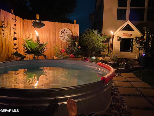 view of pool at night