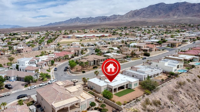 birds eye view of property featuring a mountain view