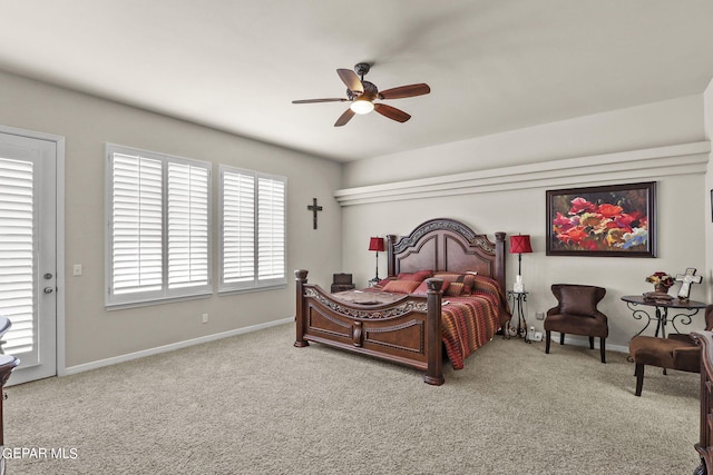 carpeted bedroom with ceiling fan and access to exterior