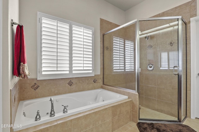 bathroom with tile patterned flooring and plus walk in shower