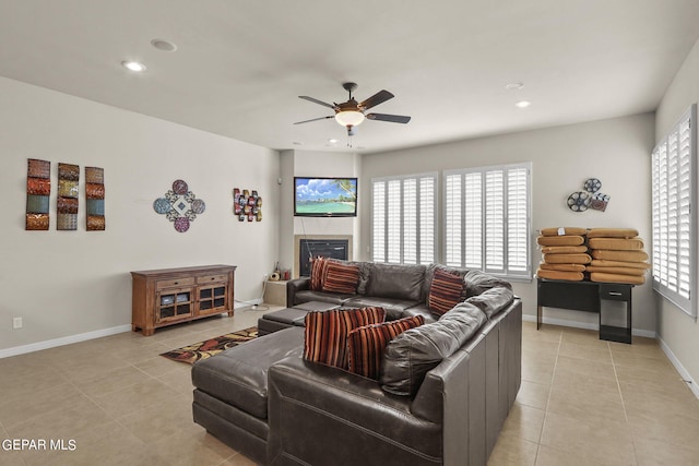 tiled living room with ceiling fan