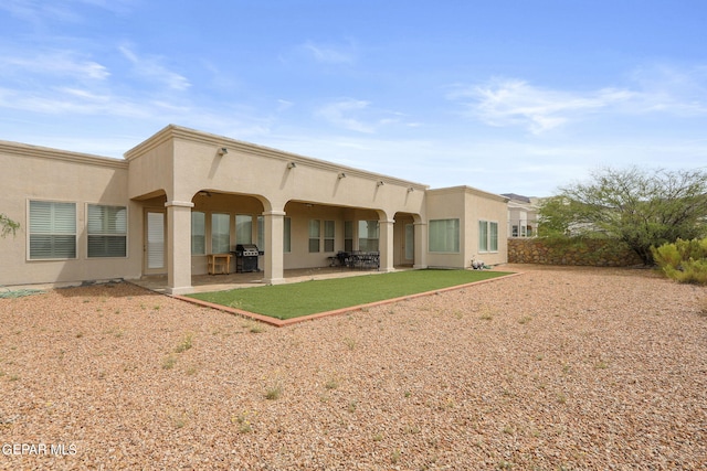 rear view of house with a patio