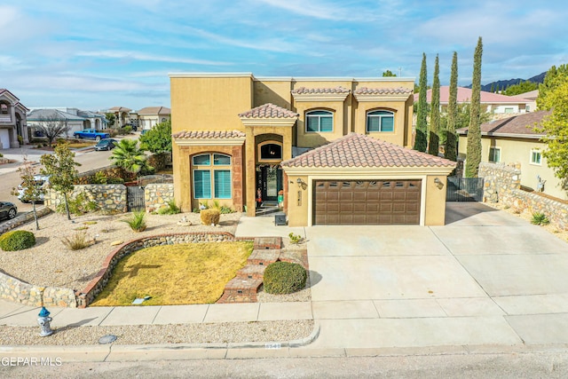 mediterranean / spanish-style house featuring a garage