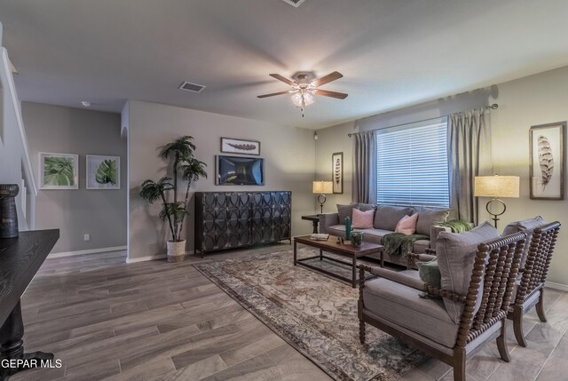 2224 Small Mountain Place, El Paso, TX 79911 - living area featuring a ceiling fan, wood finished floors, and baseboards