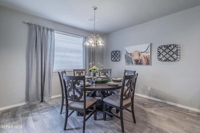 2224 Small Mountain Place, El Paso, TX 79911 - dining room with a chandelier, wood finished floors, and baseboards