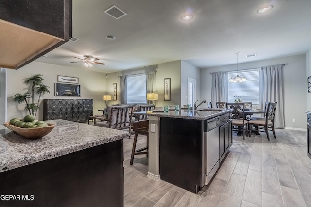2224 Small Mountain Place, El Paso, TX 79911 - kitchen featuring a sink, recessed lighting, dishwasher, a center island with sink, and stone countertops