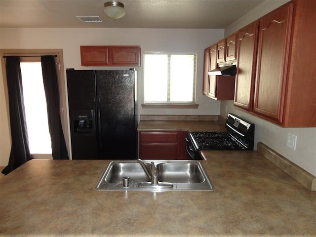 kitchen featuring black appliances and sink