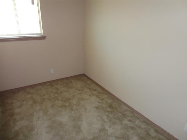 empty room featuring light colored carpet