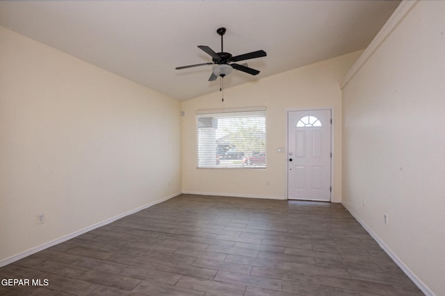 foyer entrance featuring dark wood-type flooring, lofted ceiling, and ceiling fan