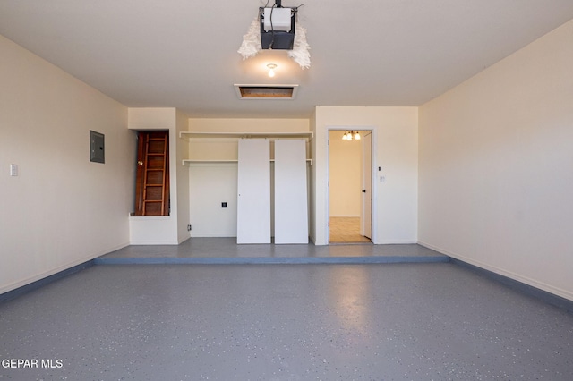 garage featuring electric panel and a garage door opener