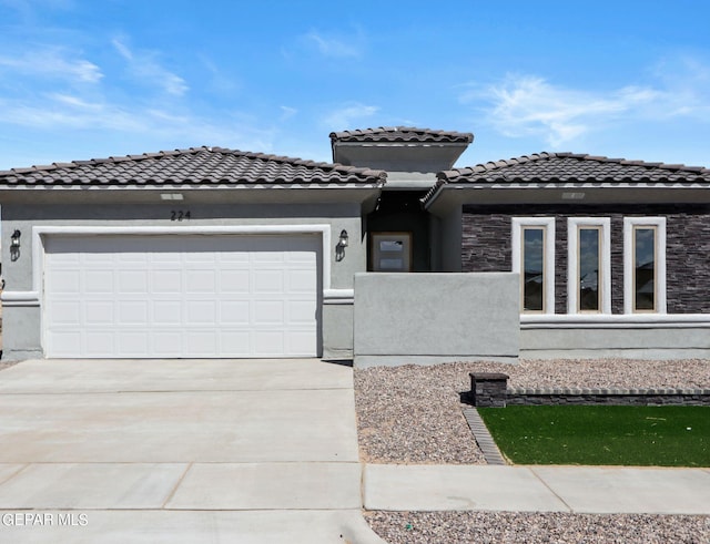 view of front of home with a garage