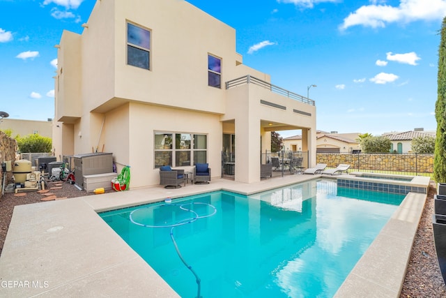 view of swimming pool featuring a patio