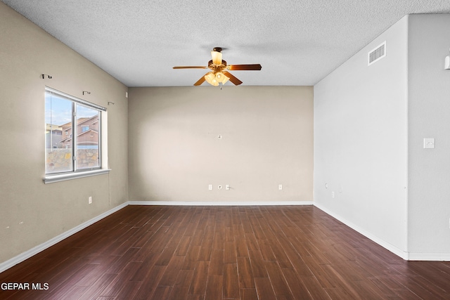 empty room with dark wood-type flooring, a textured ceiling, and ceiling fan