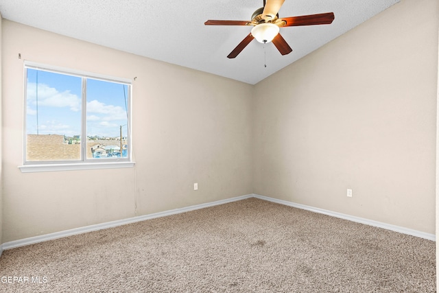 unfurnished room with a textured ceiling, ceiling fan, and carpet floors