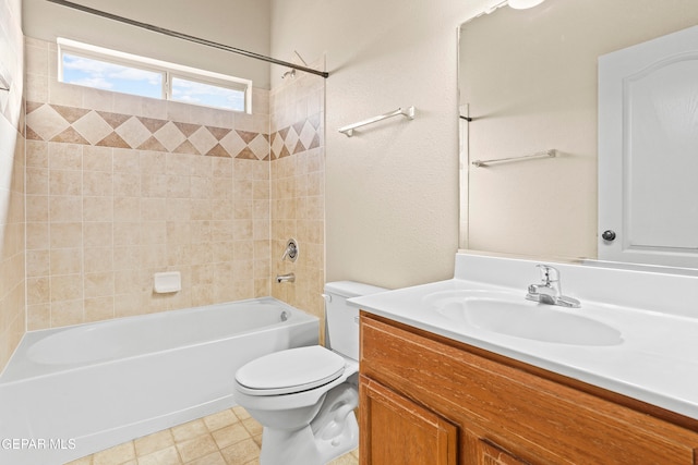 full bathroom featuring toilet, vanity, and tiled shower / bath