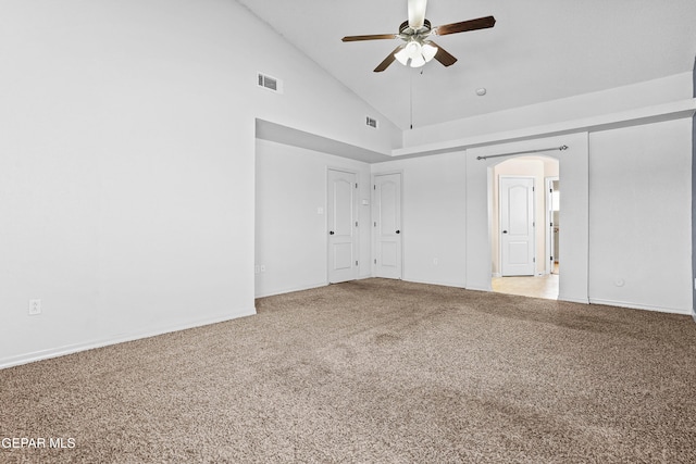 unfurnished room featuring high vaulted ceiling, light colored carpet, and ceiling fan