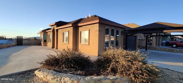 view of home's exterior with a carport