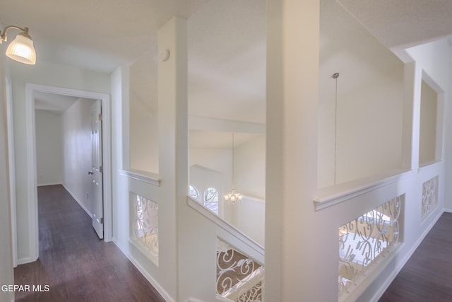 corridor featuring dark hardwood / wood-style floors