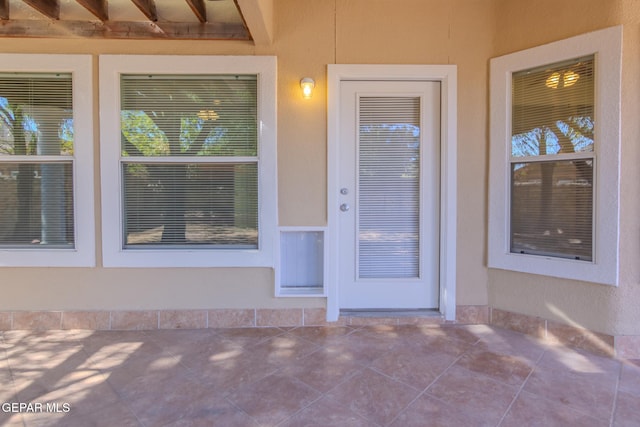 property entrance with a patio