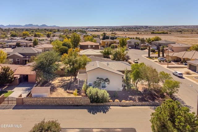 birds eye view of property featuring a mountain view