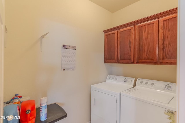 laundry room featuring cabinets and independent washer and dryer