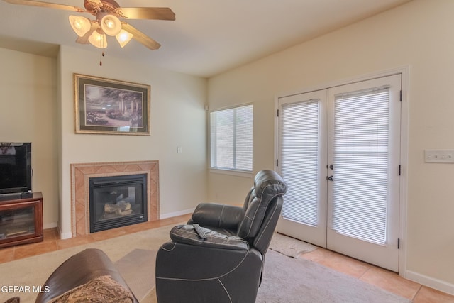 tiled living room featuring ceiling fan