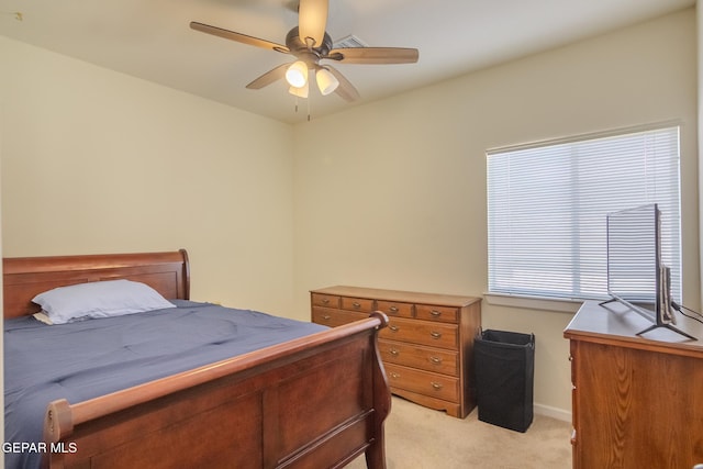 bedroom with ceiling fan and light colored carpet