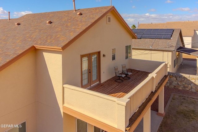 rear view of property featuring a deck